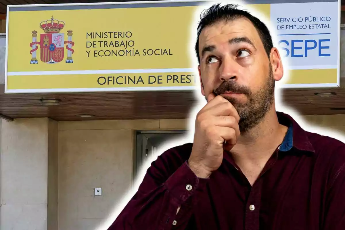Un hombre pensativo frente a una oficina del Ministerio de Trabajo y Economía Social de España. Un hombre pensativo frente a una oficina del Ministerio de Trabajo y Economía Social de España.