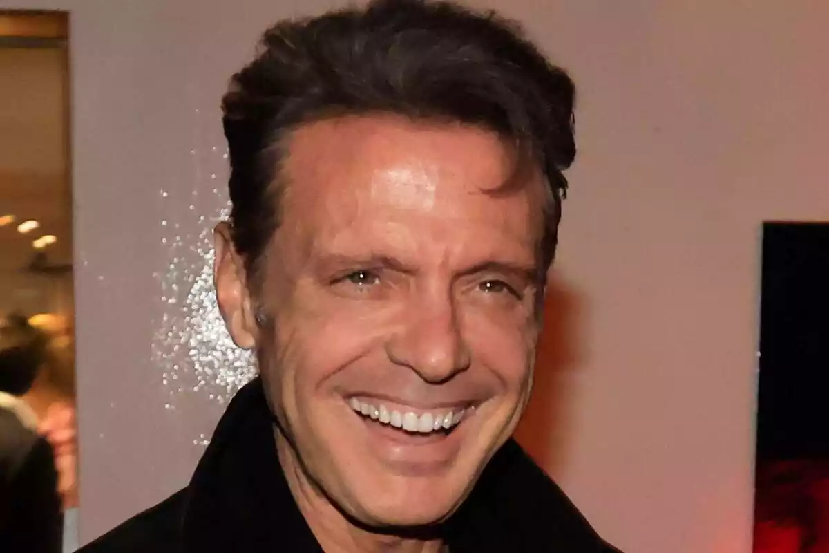 Closeup of Luis Miguel smiling at designer Rosa Clará's son's pre-wedding